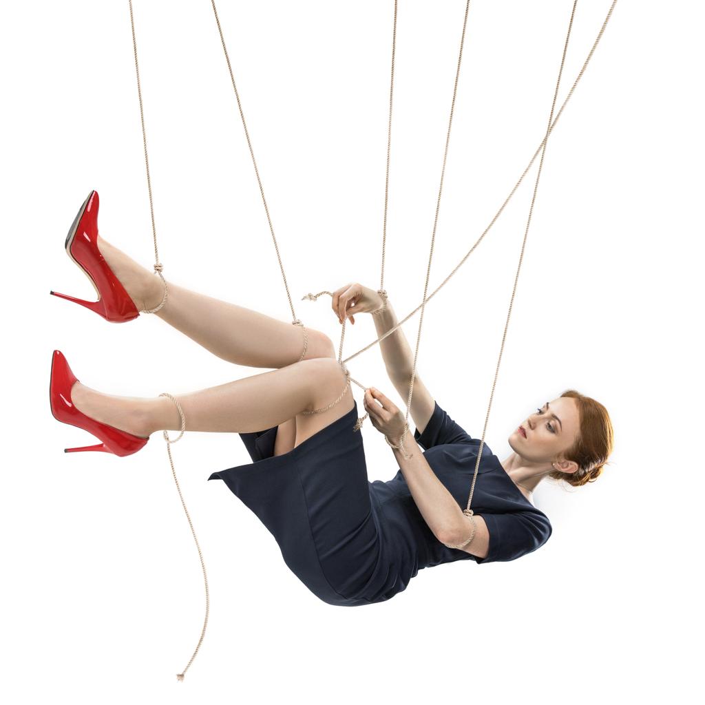 Woman suspended by ropes